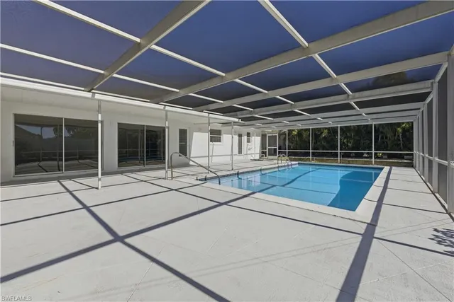a view of a swimming pool with a patio
