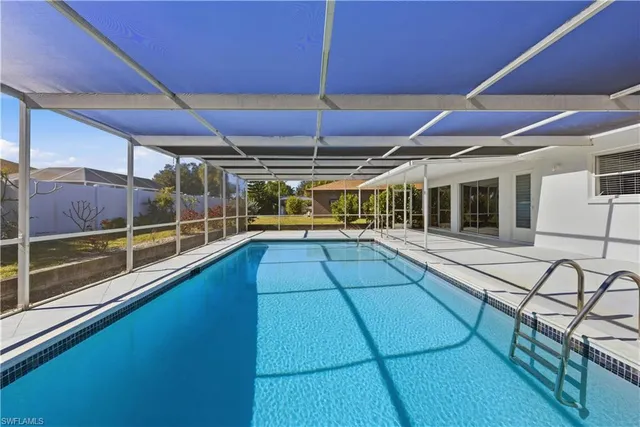 a view of a swimming pool with a patio