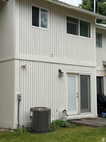 1269 North 400 East, Unit 3 Logan, UT 84341 - Photo 23 of 23 White vertical plank siding exterior with multiple windows