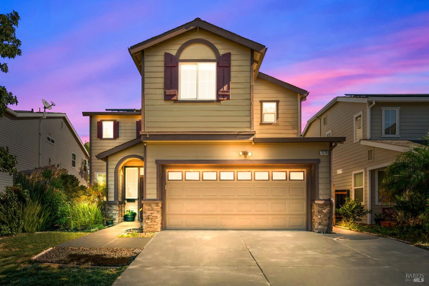 a front view of a house with a garage