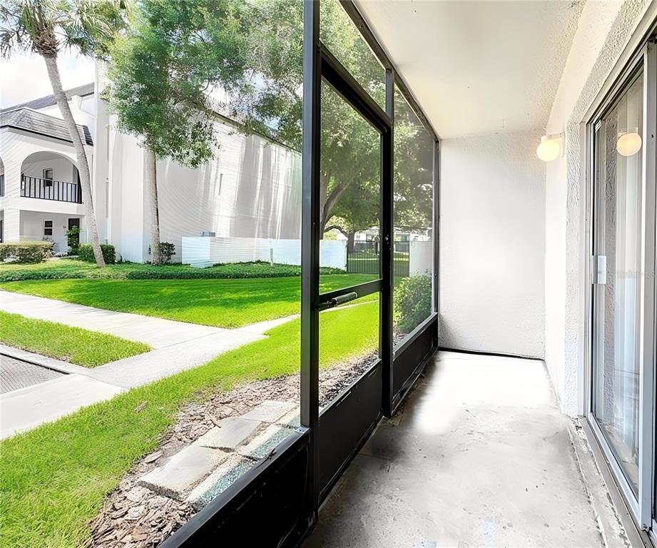 711 Russell Lane, Unit 134 Brandon, FL 33510 - Photo 21 of 24 a view of porch with a garden and trees