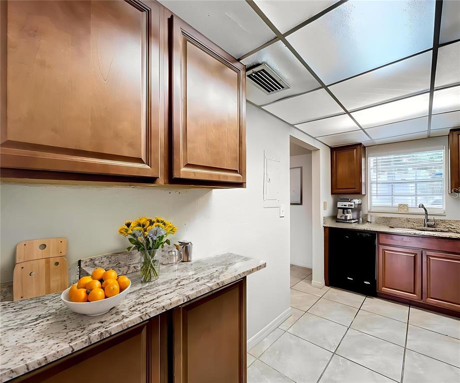 711 Russell Lane, Unit 134 Brandon, FL 33510 - Photo 6 of 24 a kitchen with granite countertop cabinets and window