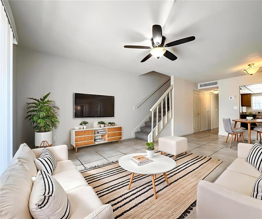 711 Russell Lane, Unit 134 Brandon, FL 33510 - Photo 8 of 24 a living room with furniture and a flat screen tv