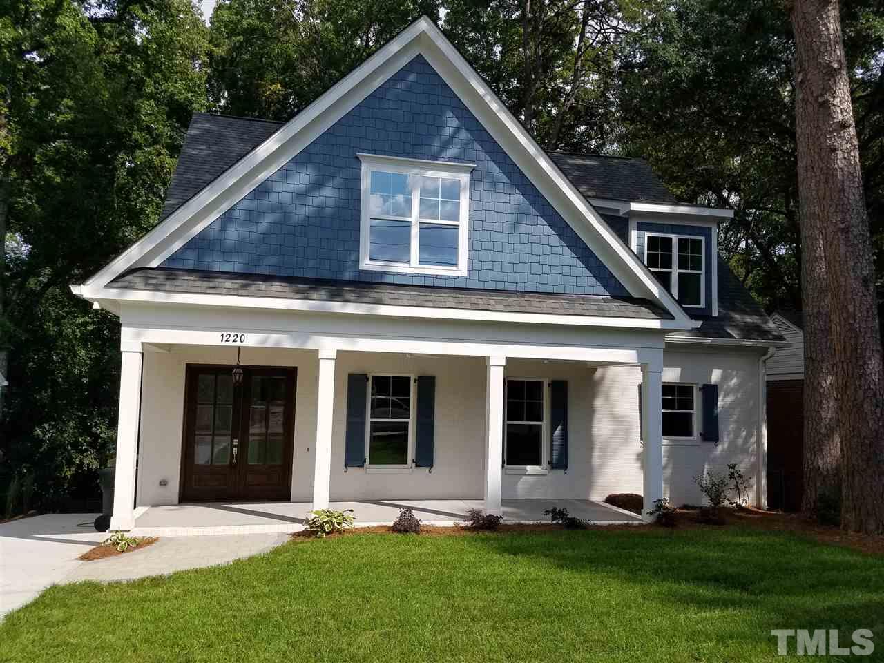 1220 Mitchell Street Raleigh, NC 27607 - Photo 1 of 25 a front view of a house with a yard