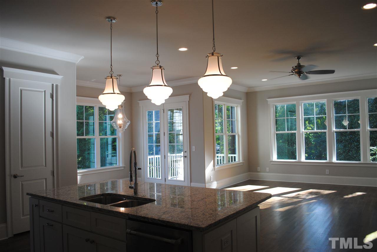 1220 Mitchell Street Raleigh, NC 27607 - Photo 7 of 25 a view of a kitchen with granite countertop a sink and chandelier