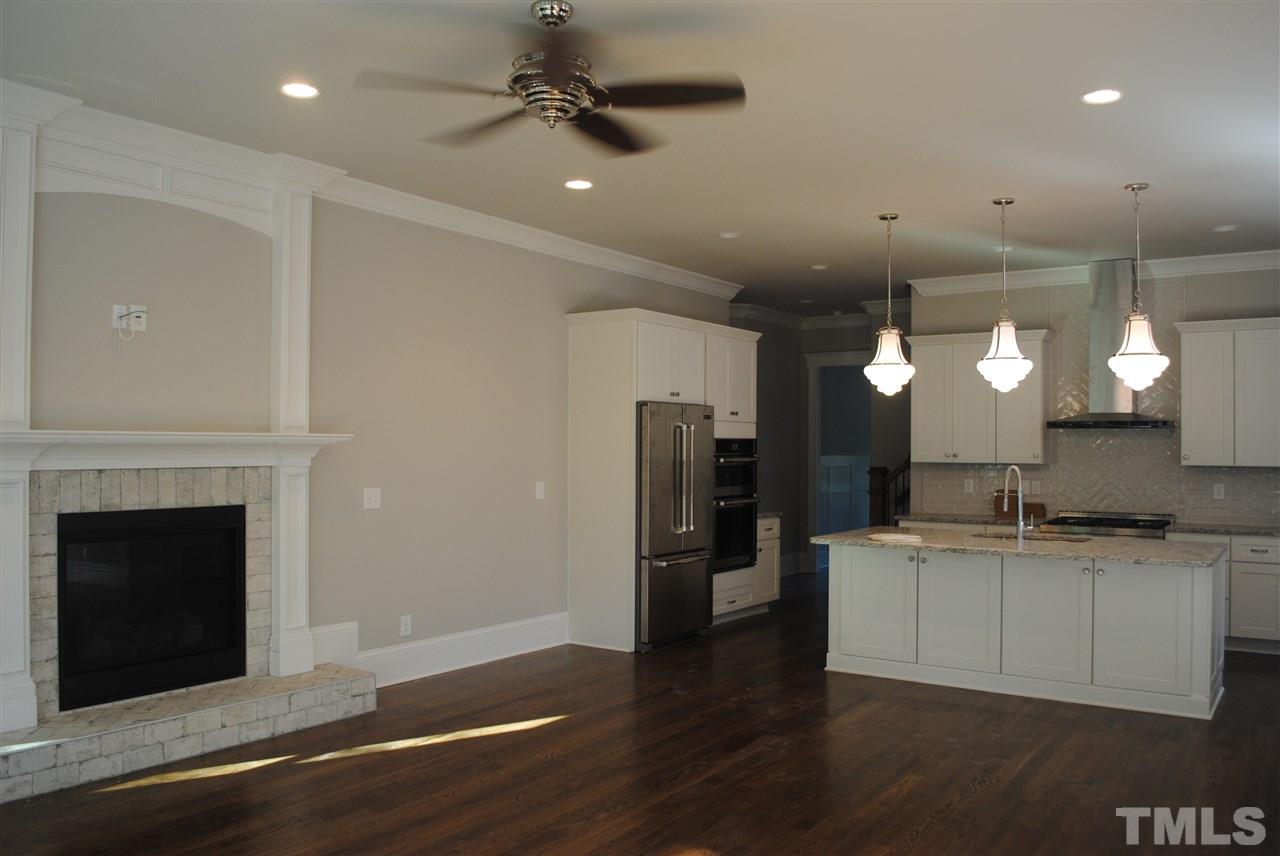 1220 Mitchell Street Raleigh, NC 27607 - Photo 9 of 25 a kitchen with a sink stainless steel appliances and cabinets