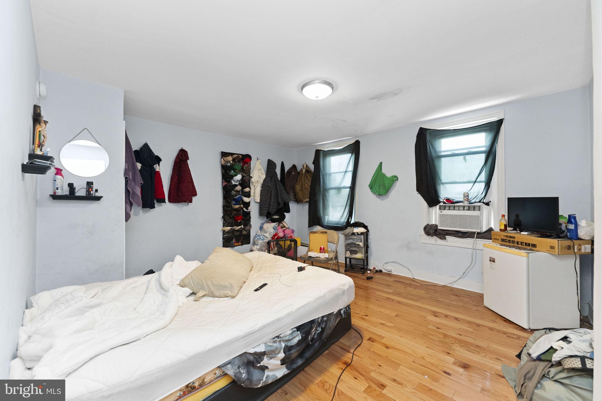 366 East Moore Street Norristown, PA 19401 - Photo 17 of 20 a bedroom with a bed and a flat screen tv