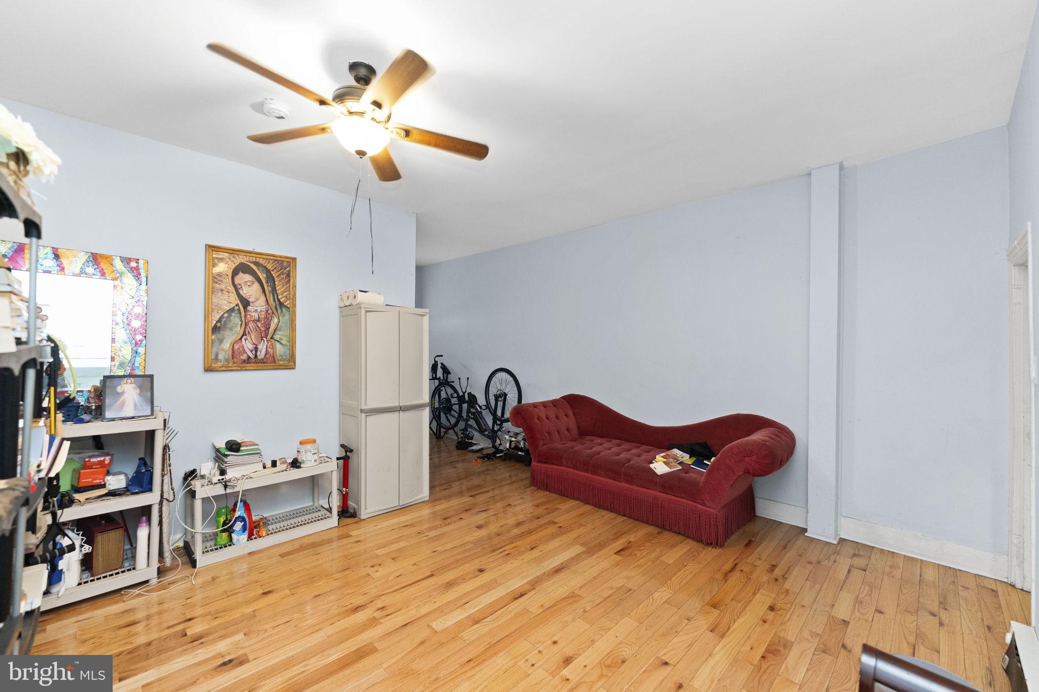 366 East Moore Street Norristown, PA 19401 - Photo 7 of 20 a living room with furniture and a wooden floor