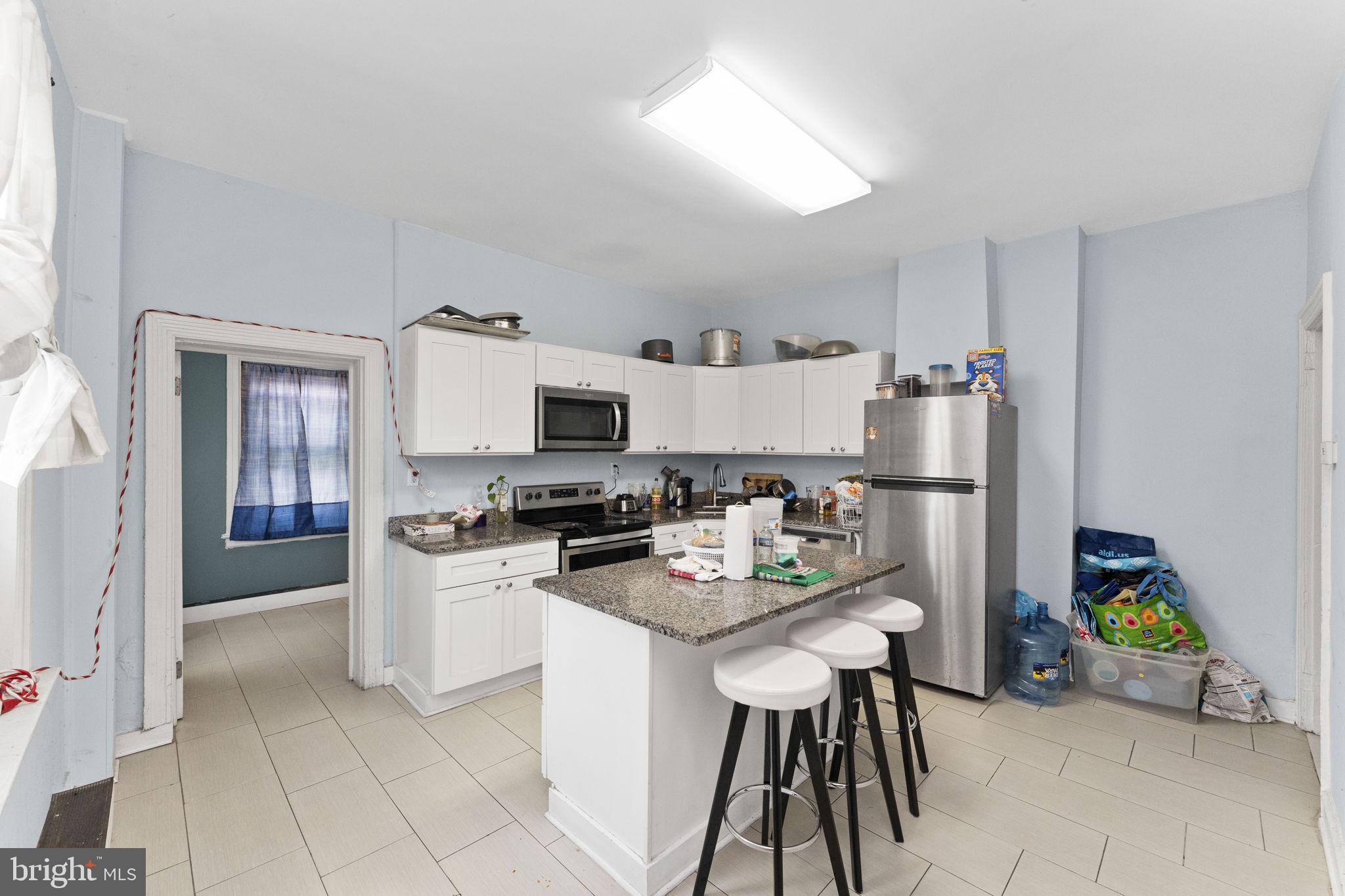366 East Moore Street Norristown, PA 19401 - Photo 8 of 20 a kitchen with stainless steel appliances a stove a sink a refrigerator a microwave and a refrigerator