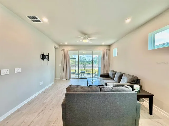 a living room with furniture and a window
