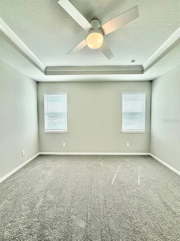 an empty room with a windows