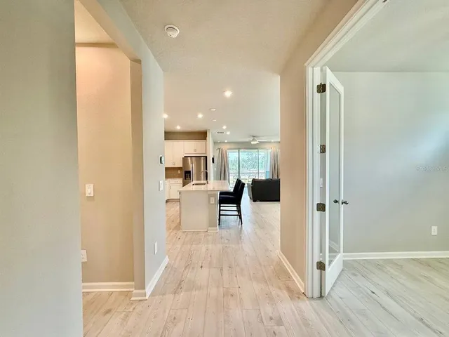 a view of a kitchen from the hallway