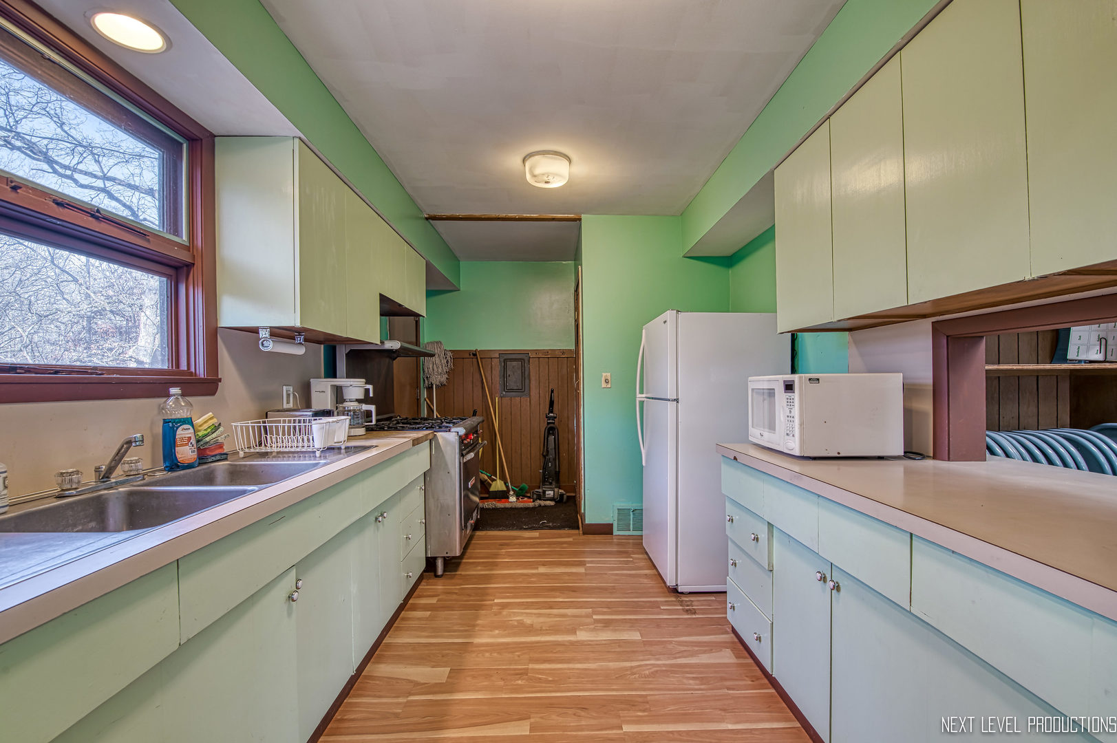1879 North 2703rd Road Ottawa, IL 61350 - Photo 22 of 40 a kitchen with sink cabinets and refrigerator