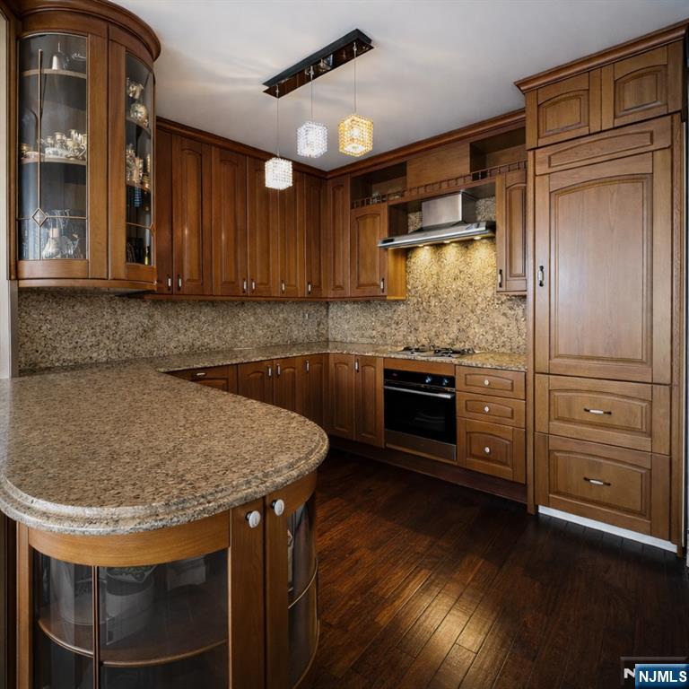 200 Old Palisade Road, Unit 18D Fort Lee, NJ 07024 - Photo 7 of 14 a kitchen with kitchen island a counter space a sink appliances and cabinets