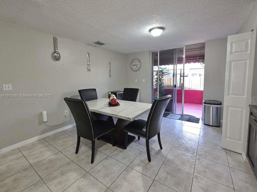 15871 Southwest 86th Terrace Miami, FL 33193 - Photo 5 of 30 a view of a dining room with furniture