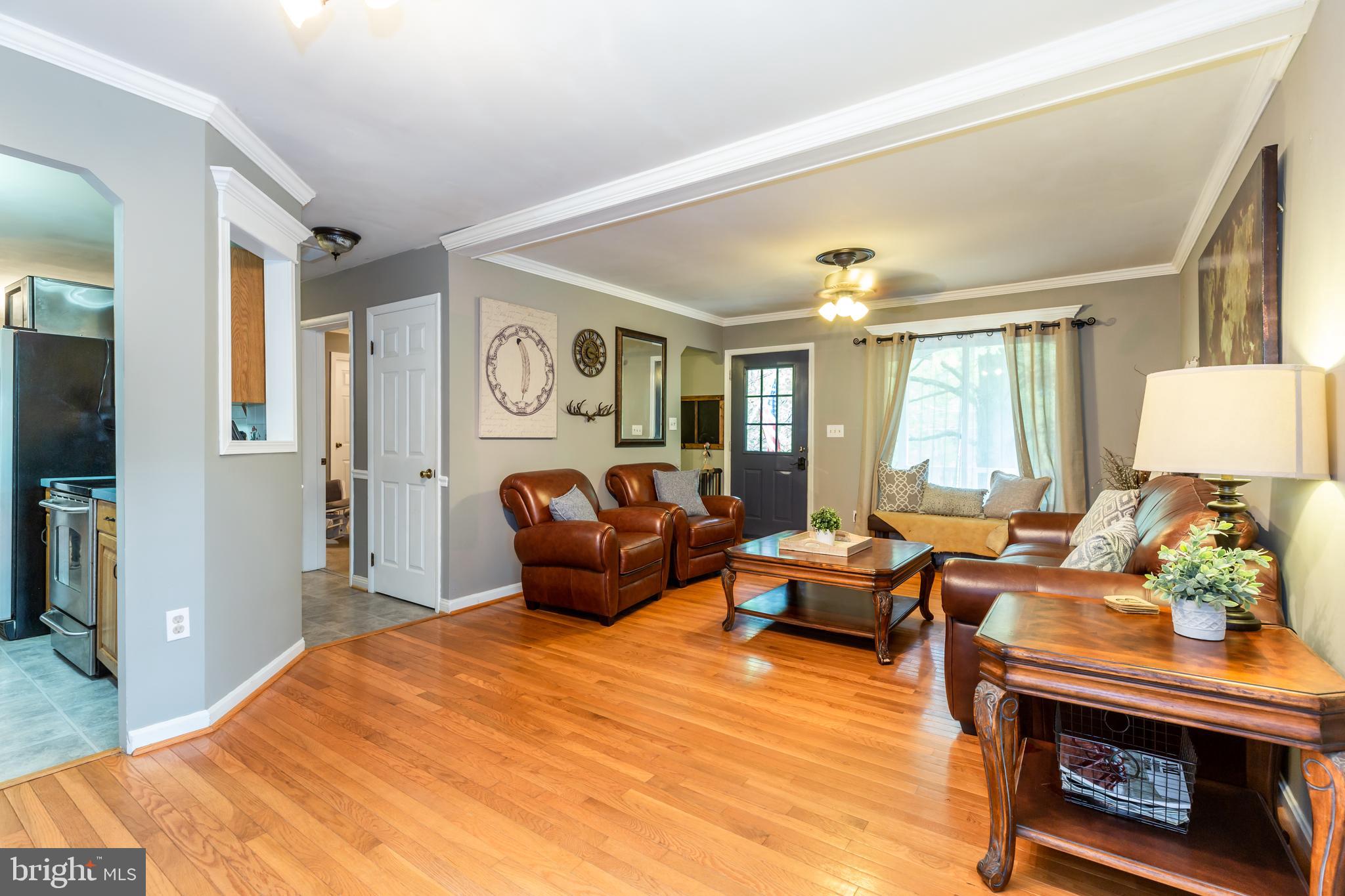 12503 Purcell Road Manassas, VA 20112 - Photo 11 of 46 Hardwood in family room and view into kitchen