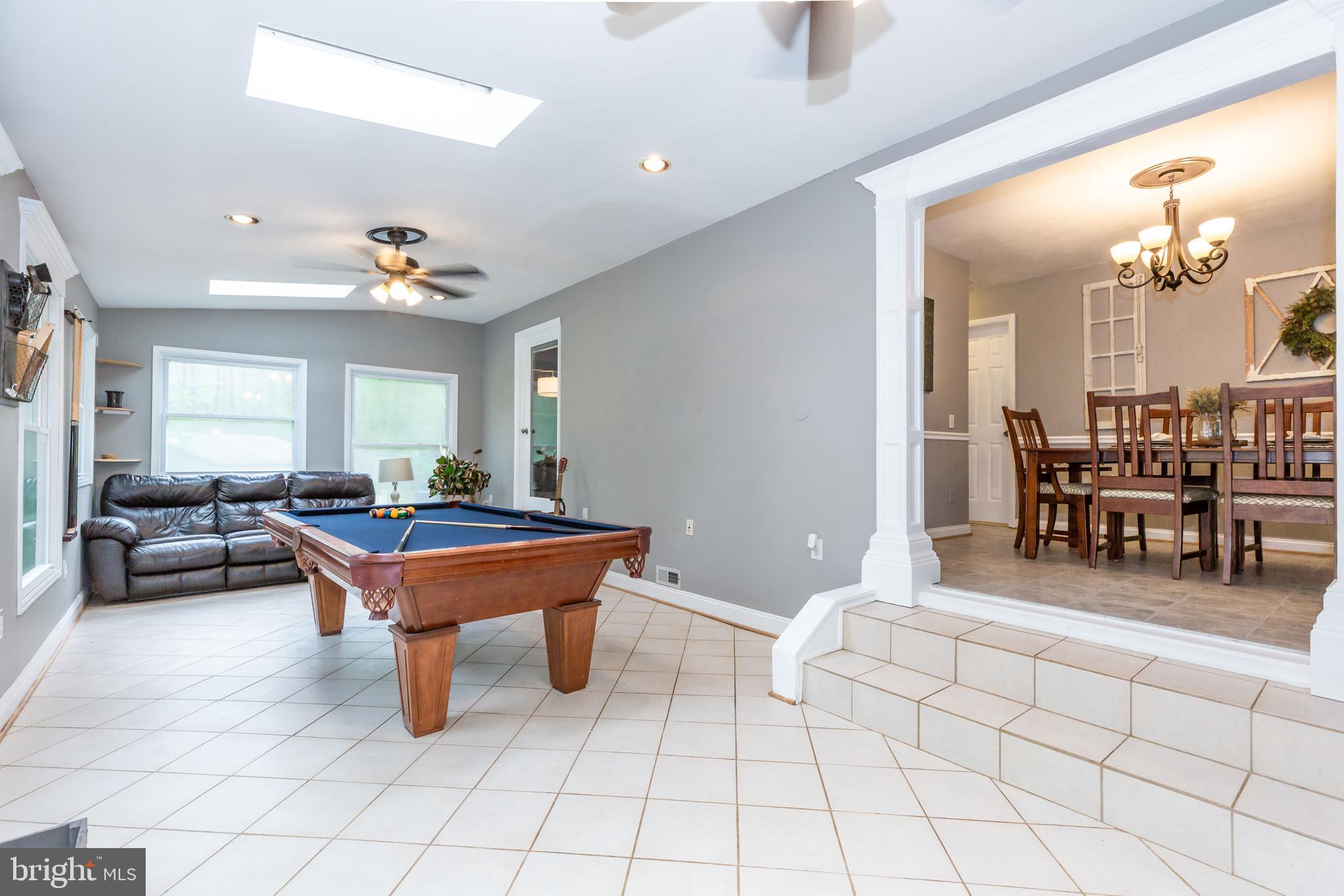 12503 Purcell Road Manassas, VA 20112 - Photo 18 of 46 Tiled sunroom with skylights and two ceiling fans