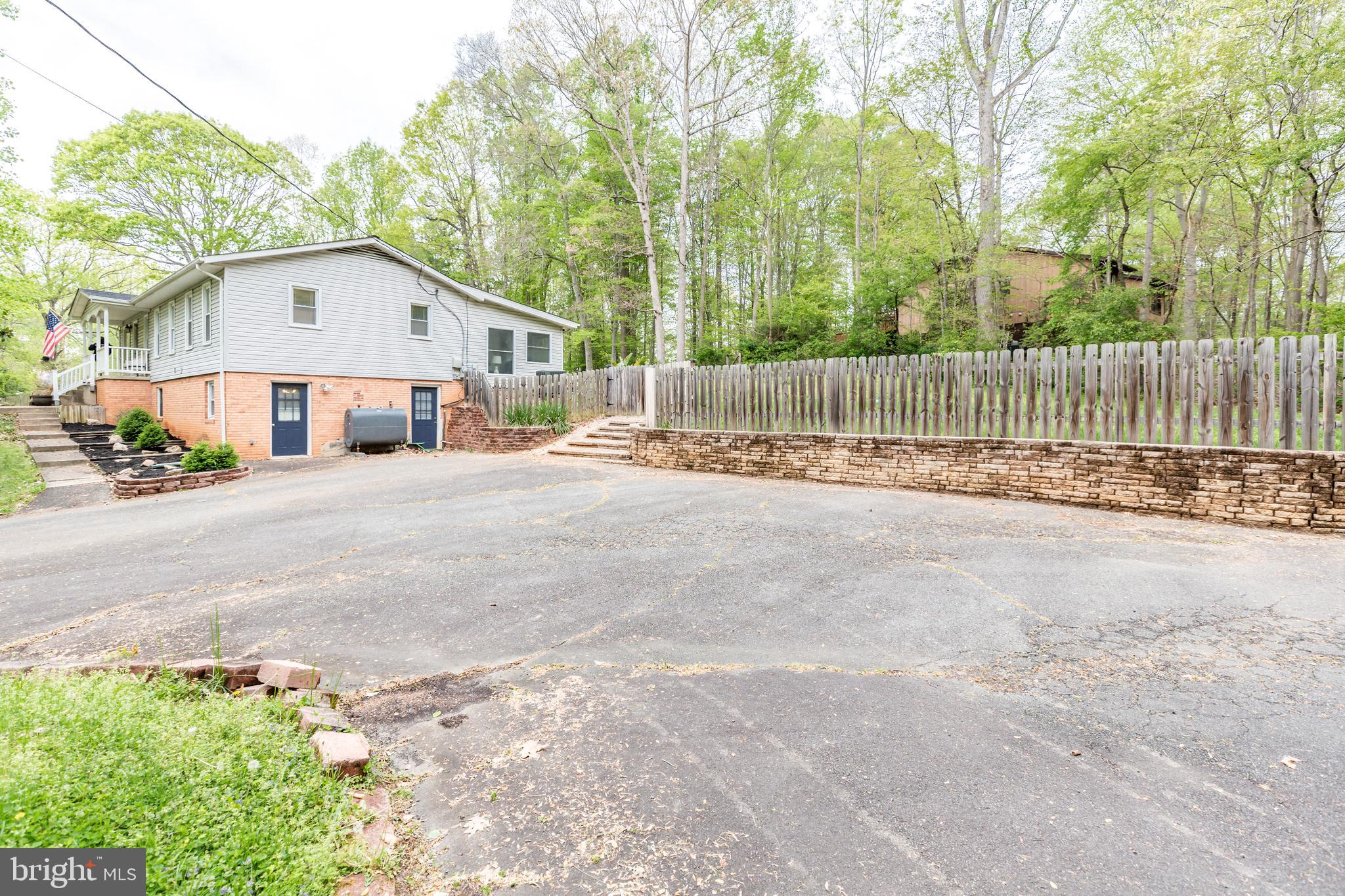 12503 Purcell Road Manassas, VA 20112 - Photo 5 of 46 Stone retaining wall with steps and ramp to yard
