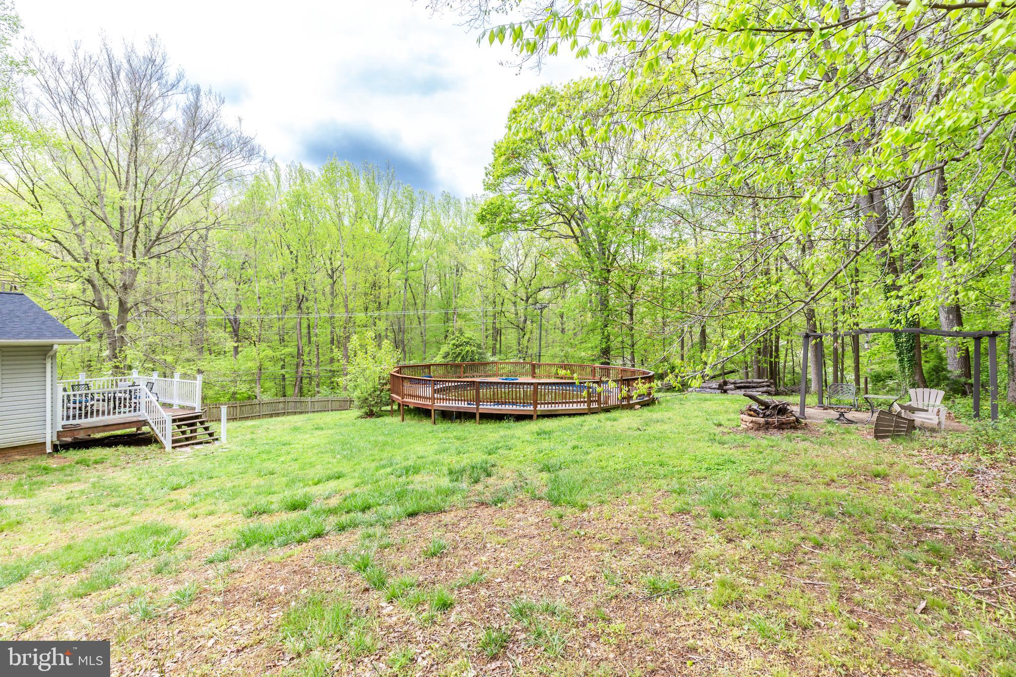 12503 Purcell Road Manassas, VA 20112 - Photo 42 of 46 View of side deck, pool and fire pit
