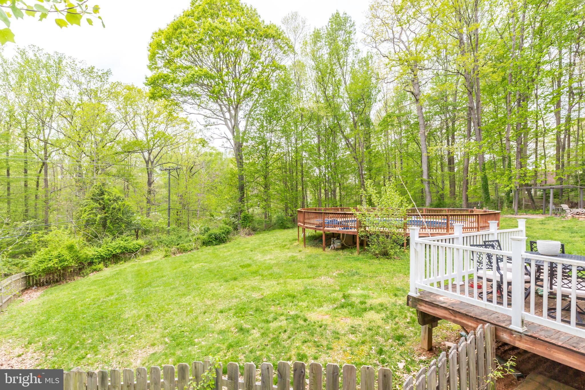 12503 Purcell Road Manassas, VA 20112 - Photo 8 of 46 Large fenced in backyard view towards pool