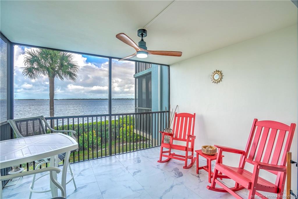 10 Northeast Plantation Road, Unit 101 Jensen Beach, FL 34957 - Photo 12 of 53 a bedroom with furniture and a window