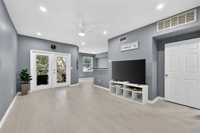 a kitchen with granite countertop a sink stainless steel appliances and cabinets