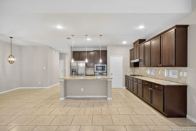 a large kitchen with cabinets