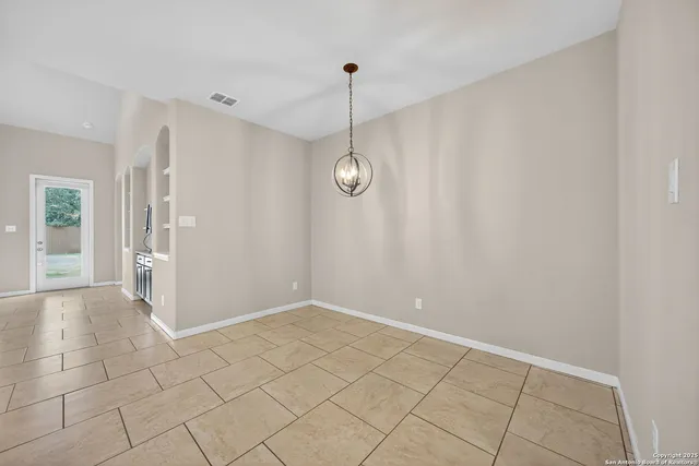 a view of an empty room and window