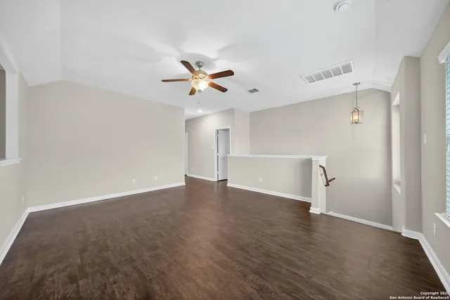 a view of an empty room with a window