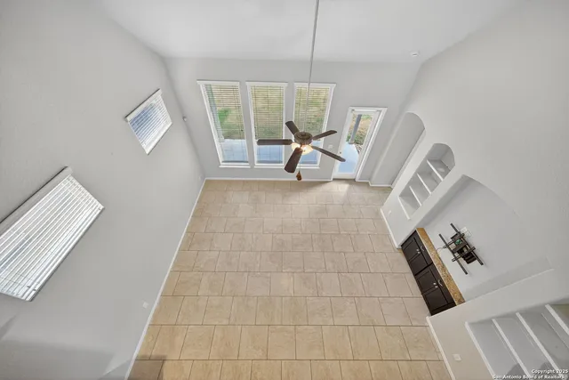 a view of an empty room with a fireplace