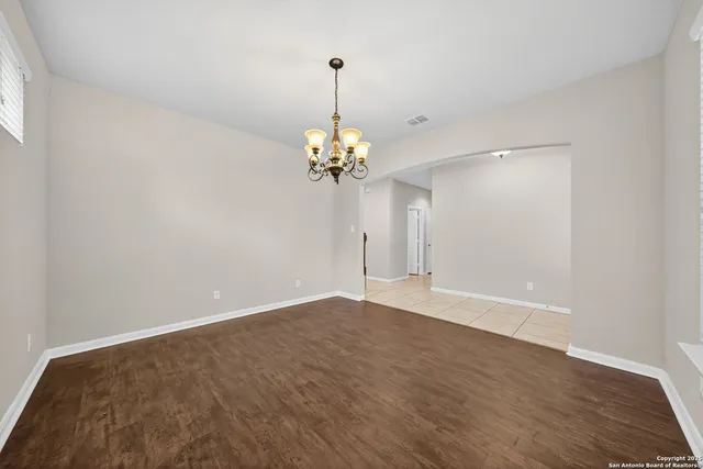 a view of a chandelier in big room and chandelier