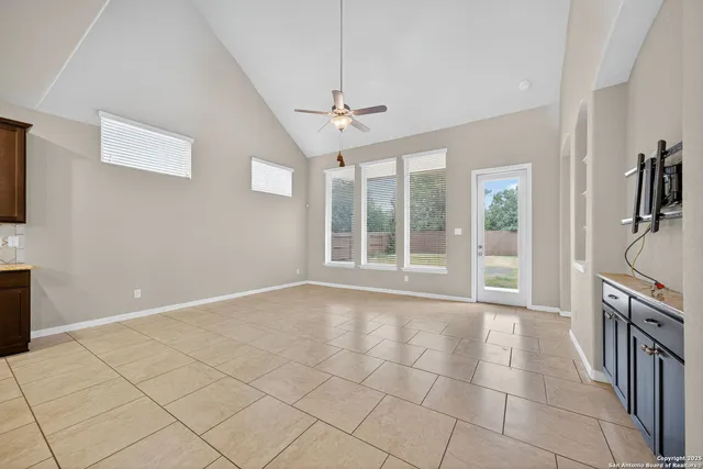 a view of an empty room with a fireplace