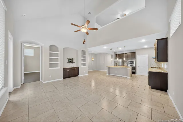 a view of a kitchen with a sink and a stove top oven