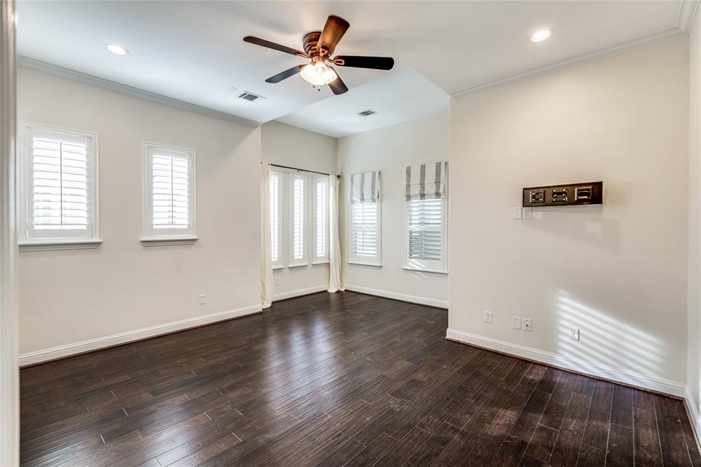 6109 Stillman Street Houston, TX 77007 - Photo 12 of 28 a view of an empty room with a window and wooden floor