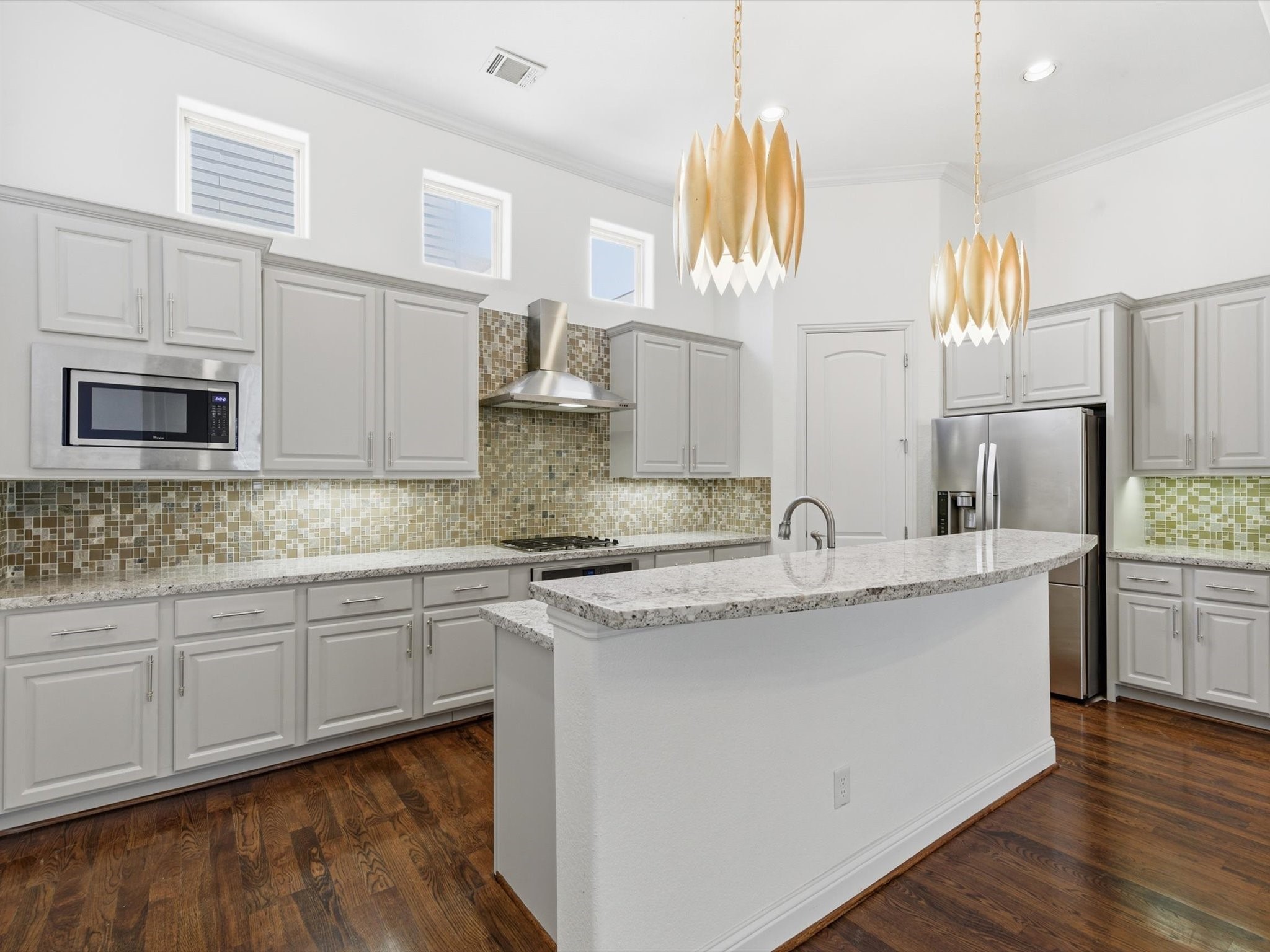 6109 Stillman Street Houston, TX 77007 - Photo 2 of 28 a kitchen with stainless steel appliances granite countertop a sink a stove and a wooden cabinets