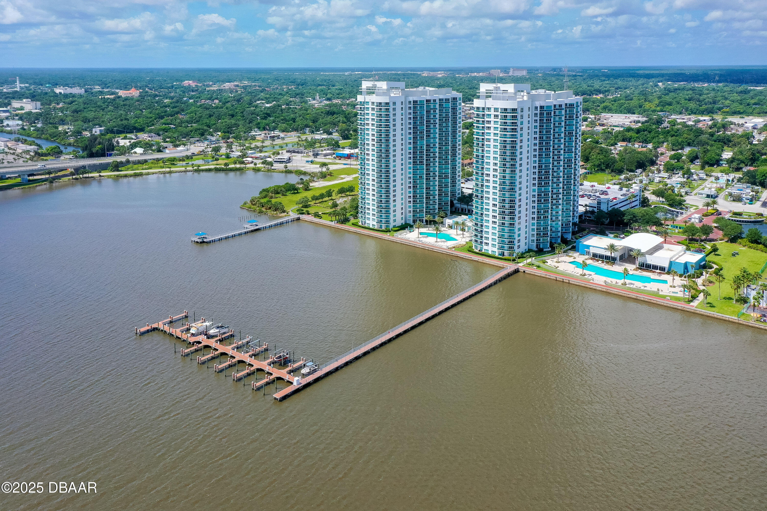 241 Riverside Drive, Unit 2603 Holly Hill, FL 32117 - Photo 1 of 71 an aerial view of a house with a garden and lake view