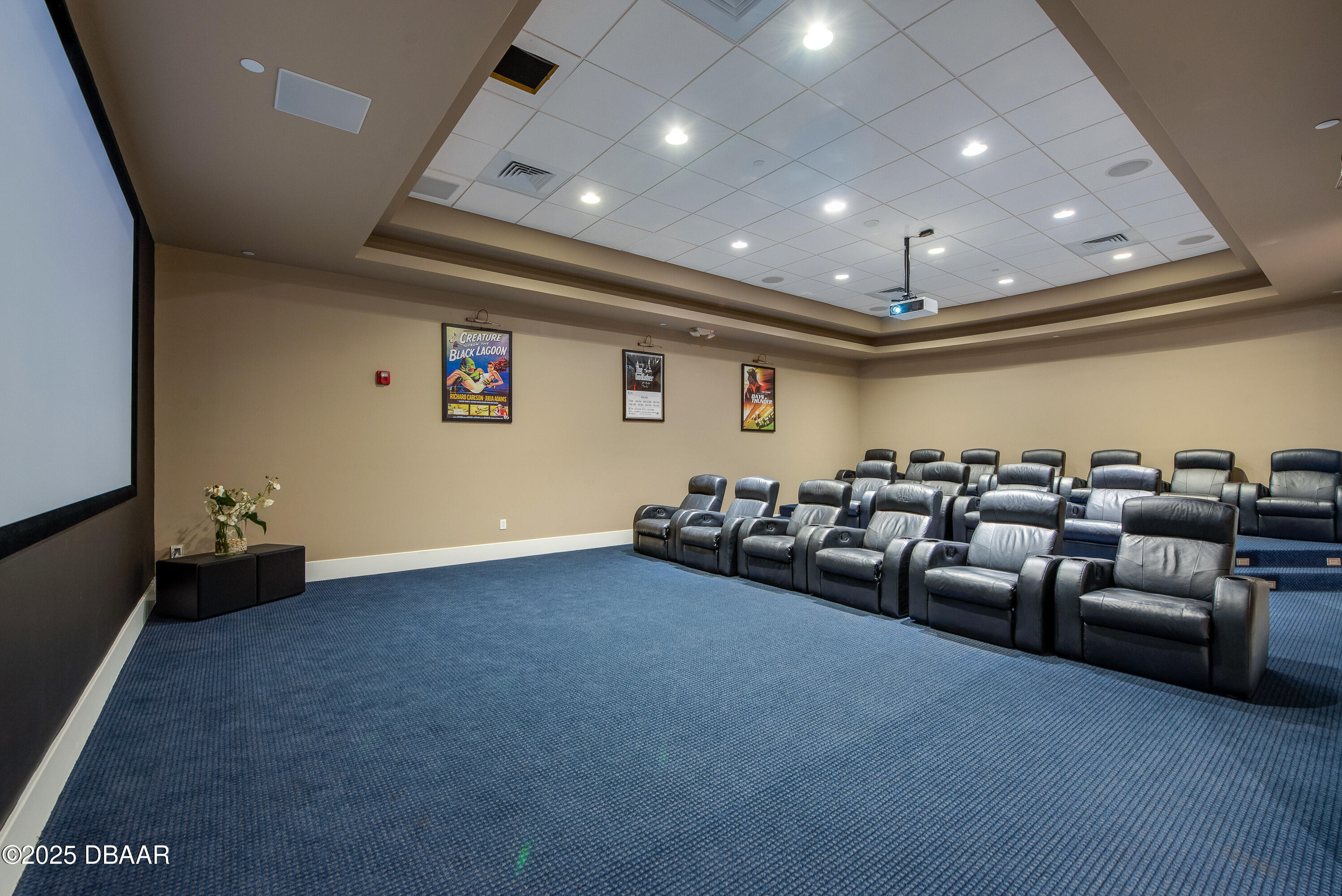 241 Riverside Drive, Unit 2603 Holly Hill, FL 32117 - Photo 14 of 71 a big room with lots of furniture and a projector screen