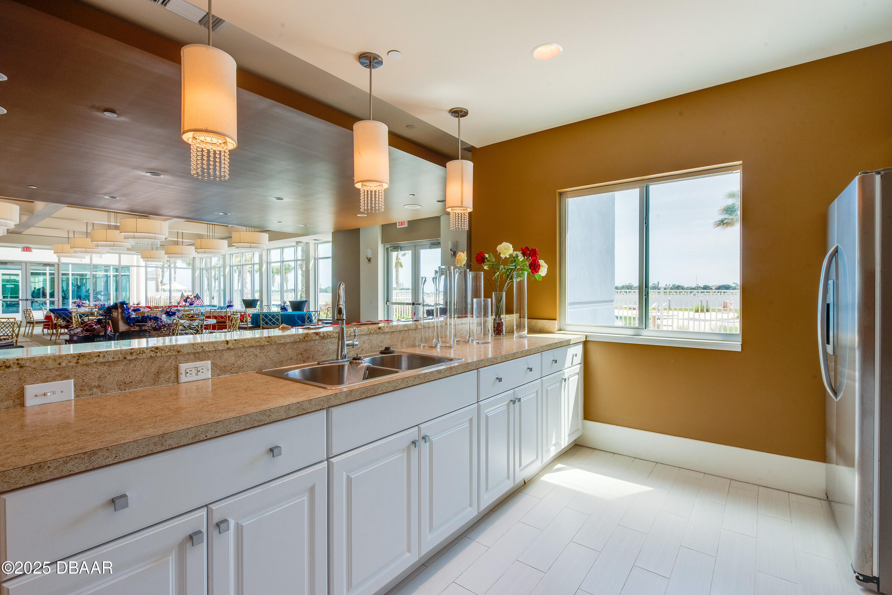 241 Riverside Drive, Unit 2603 Holly Hill, FL 32117 - Photo 17 of 71 a kitchen with stainless steel appliances granite countertop a sink and a refrigerator