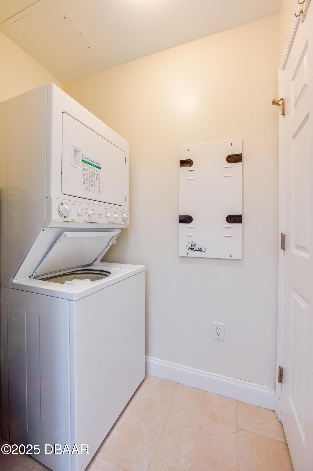 241 Riverside Drive, Unit 2603 Holly Hill, FL 32117 - Photo 23 of 71 a utility room with dryer and washer