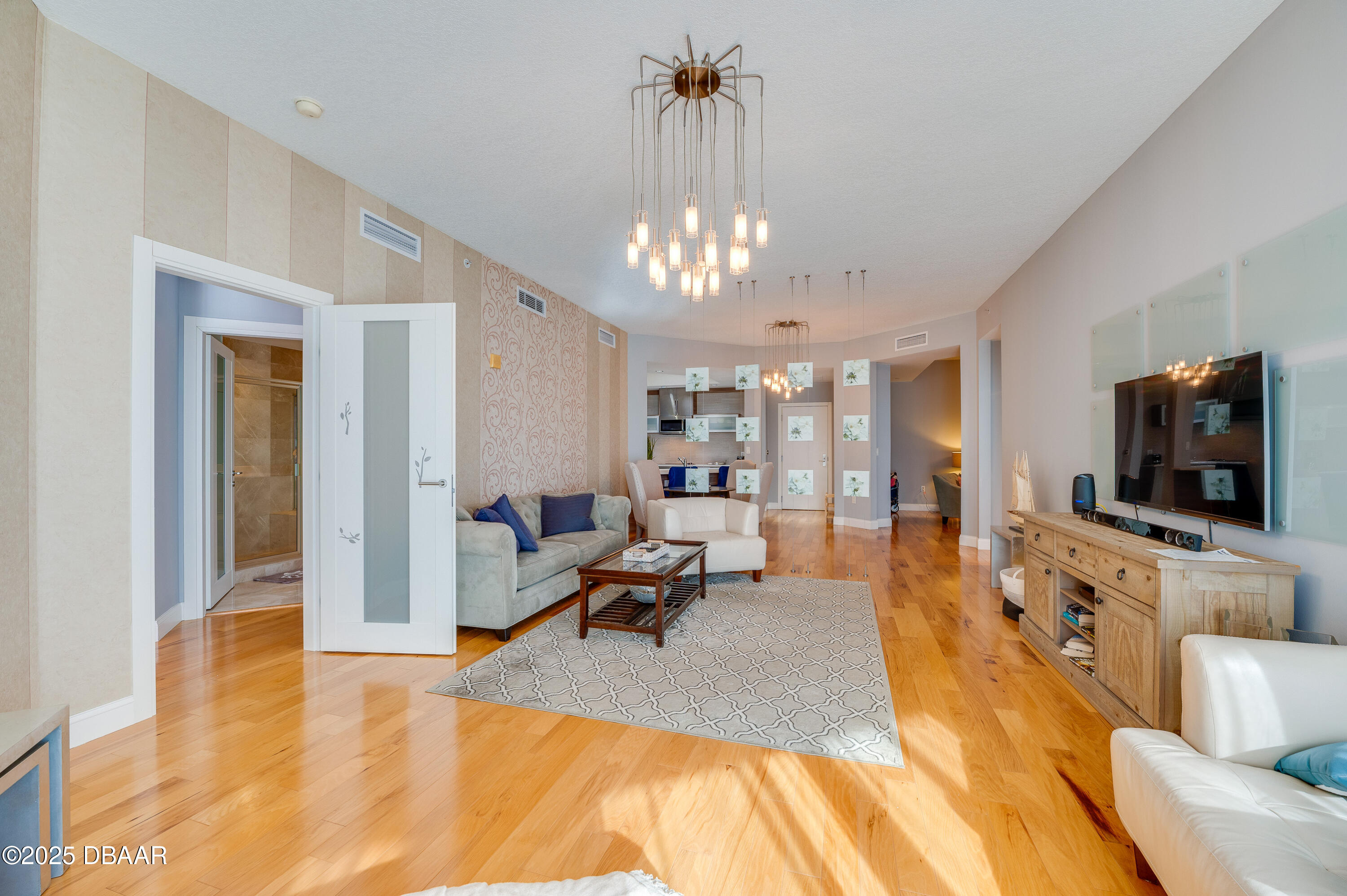 241 Riverside Drive, Unit 2603 Holly Hill, FL 32117 - Photo 33 of 71 a living room with furniture and a flat screen tv