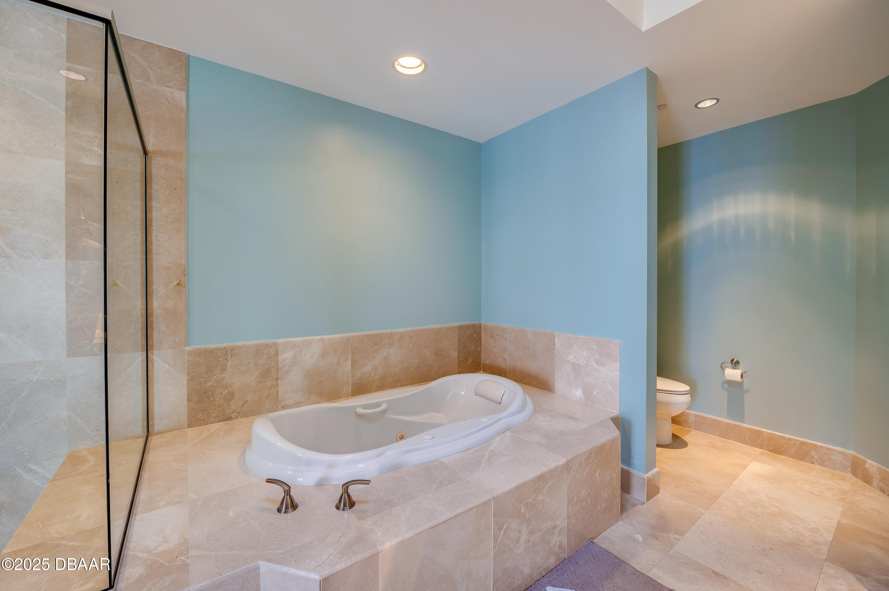 241 Riverside Drive, Unit 2603 Holly Hill, FL 32117 - Photo 37 of 71 a bathroom with a tub and toilet