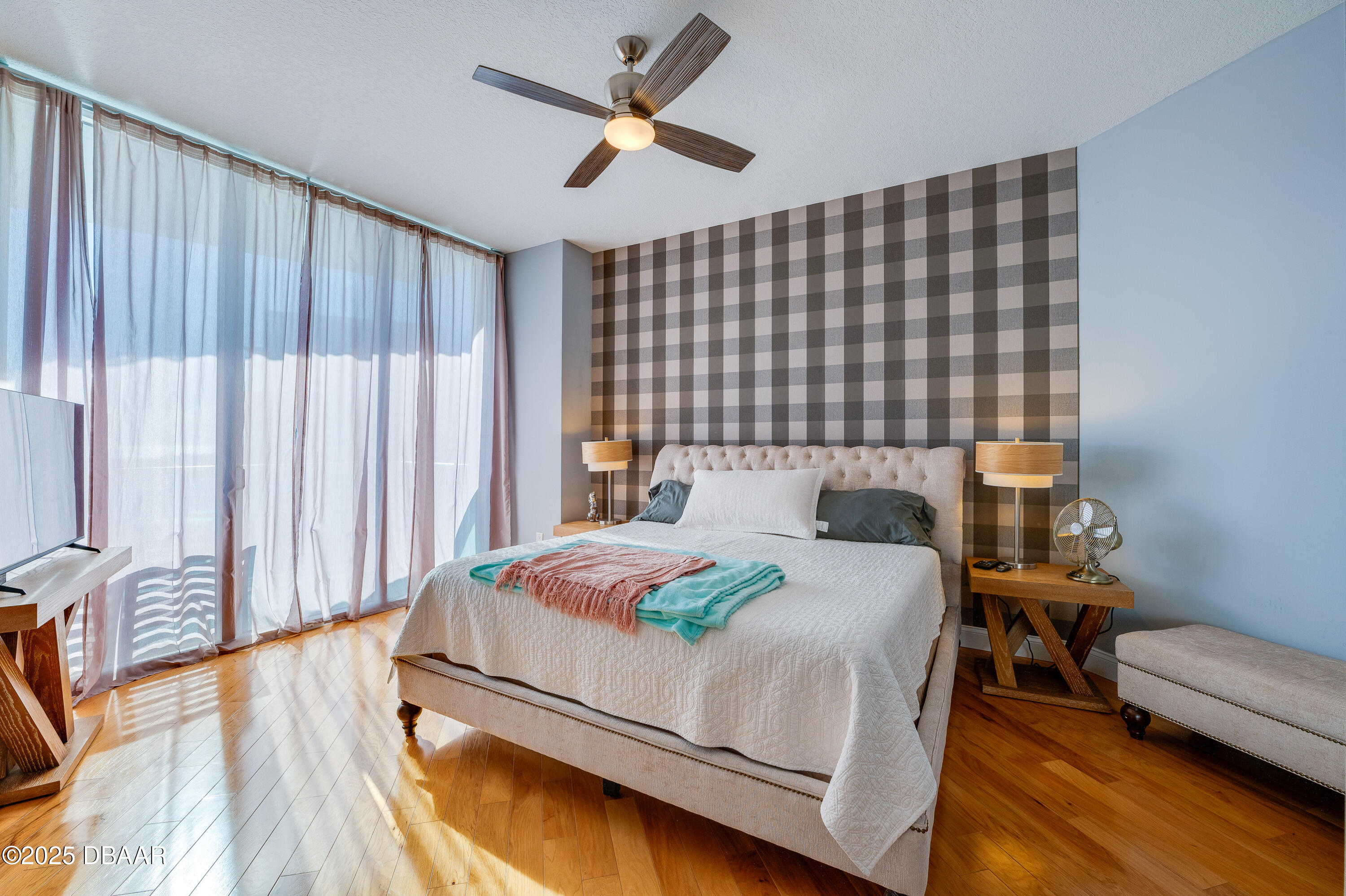 241 Riverside Drive, Unit 2603 Holly Hill, FL 32117 - Photo 39 of 71 a bedroom with a bed and a couch