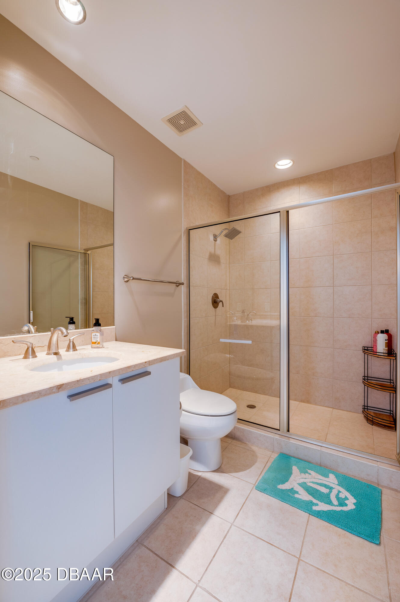 241 Riverside Drive, Unit 2603 Holly Hill, FL 32117 - Photo 44 of 71 a bathroom with a sink a toilet and shower