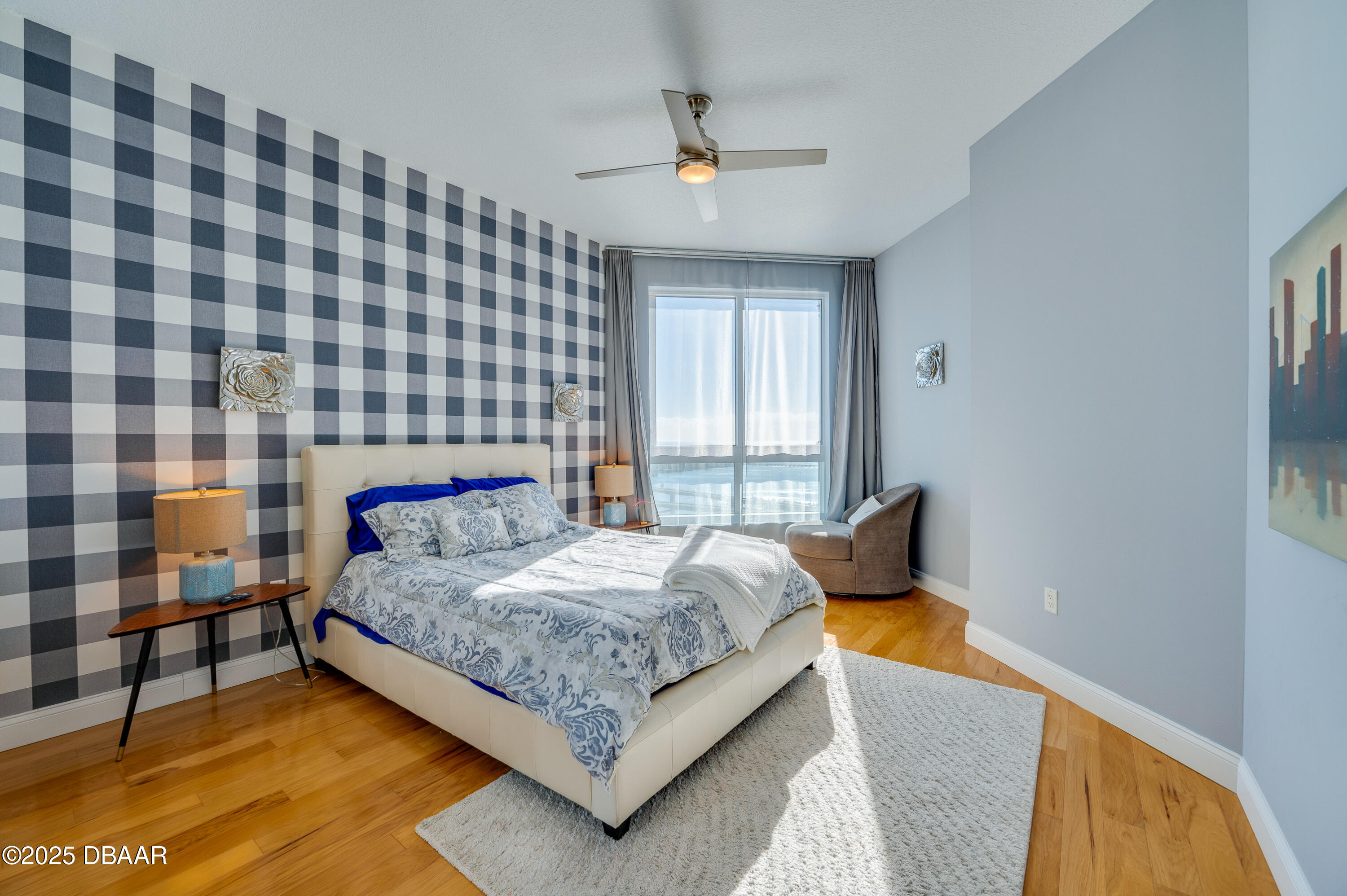 241 Riverside Drive, Unit 2603 Holly Hill, FL 32117 - Photo 46 of 71 a bedroom with a bed and lamp