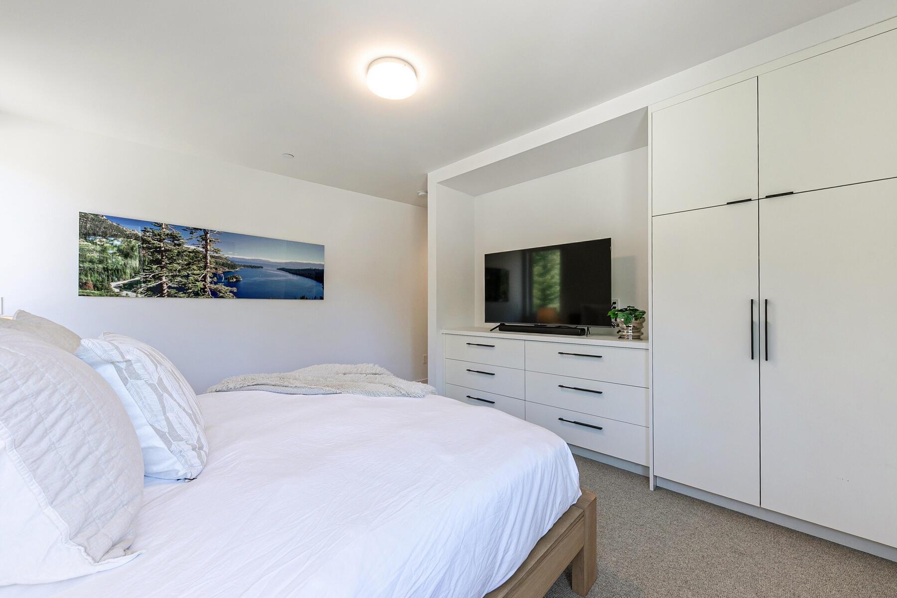 260 Palisades Circle Olympic Valley, CA 96146 - Photo 12 of 28 a bedroom with a bed and a flat screen tv
