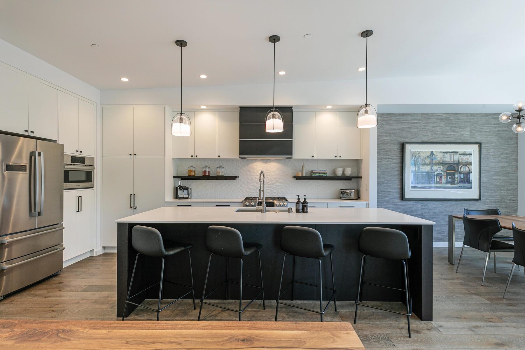 260 Palisades Circle Olympic Valley, CA 96146 - Photo 5 of 28 a kitchen with kitchen island stainless steel appliances a dining table and chairs