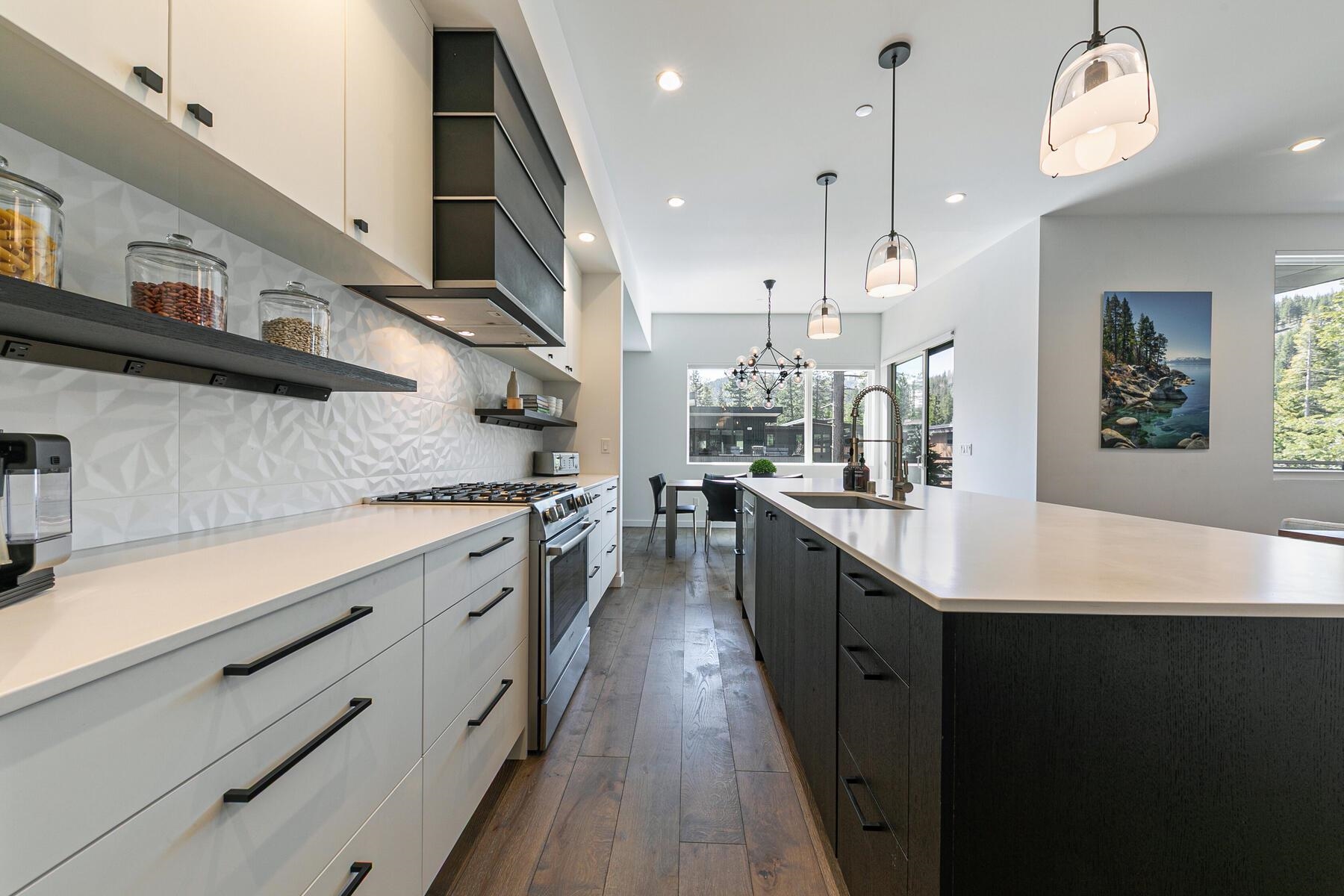 260 Palisades Circle Olympic Valley, CA 96146 - Photo 7 of 28 a kitchen with stainless steel appliances kitchen island a large island in the center