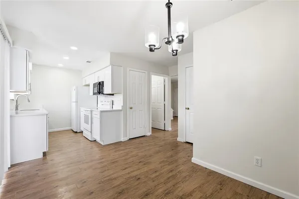 a view of a kitchen with wooden floor