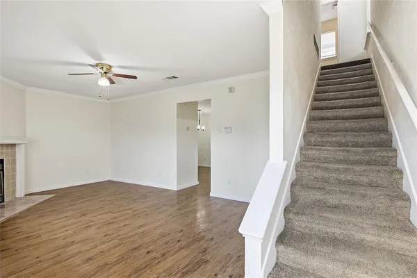 a view of entryway and hall with wooden floor