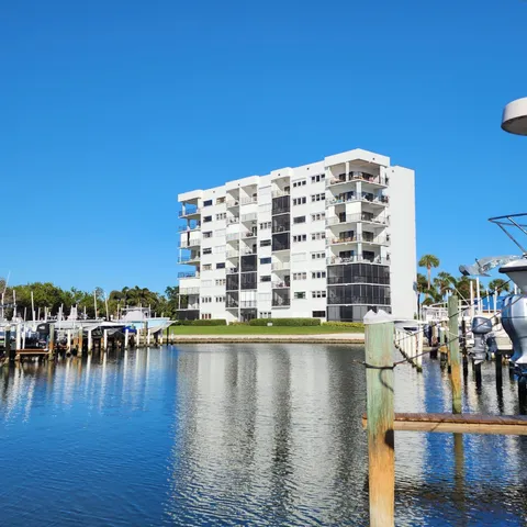 a view of swimming pool with outdoor seating and city view